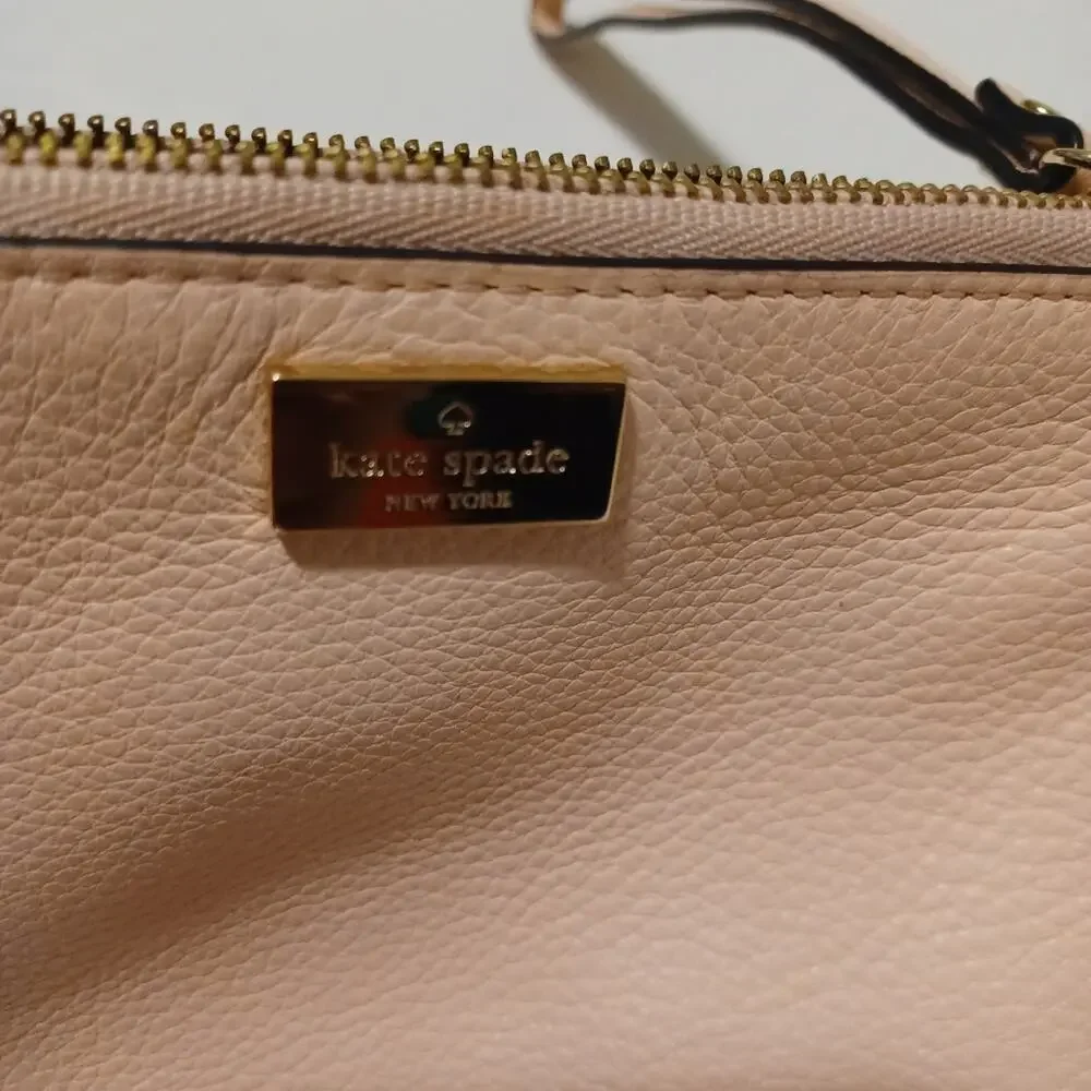 Kate Spade New York Pink Tone Wristlet.